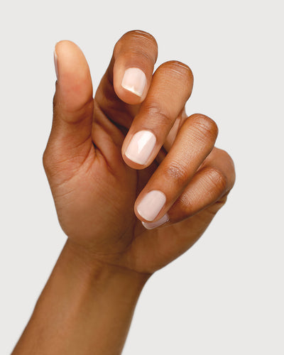light rosewater pink sheer nail polish hand swatch on medium skin tone
