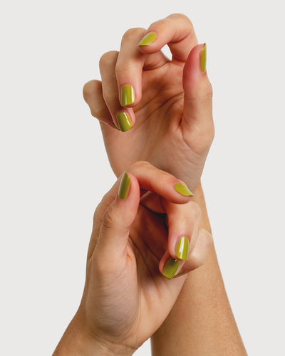 Avocado green nail polish hand swatch on fair skin tone hands