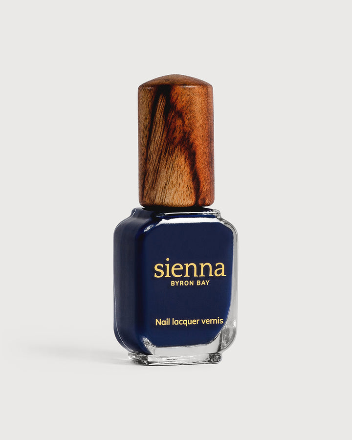 Classic navy blue nail polish glass bottle with timber cap
