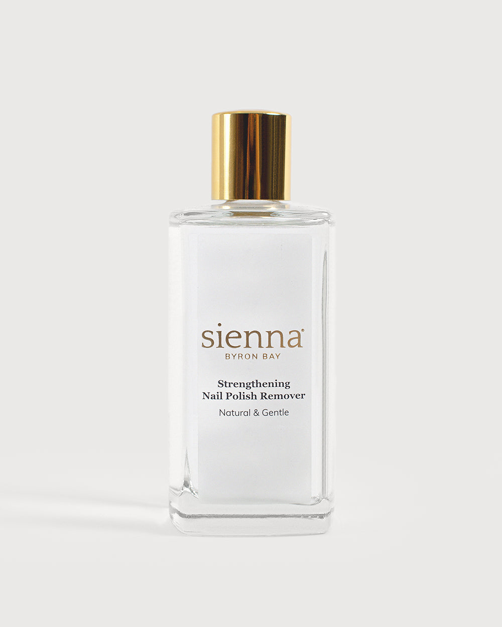 Strengthening nail polish remover bottle on white background