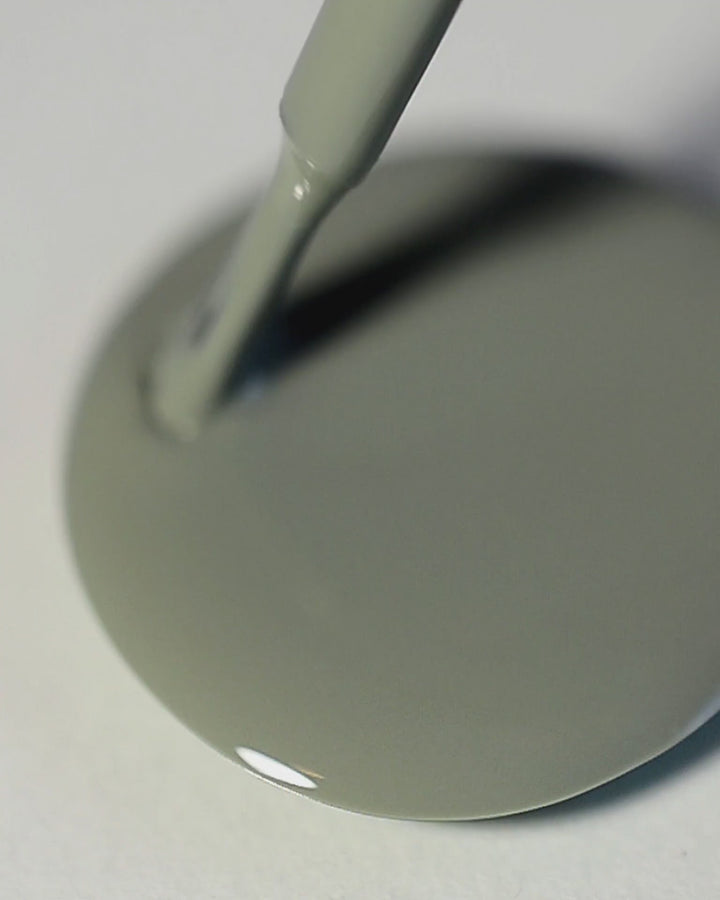 A nail polish swirl of Soundscape sage green crème by Sienna Byron Bay close-up.