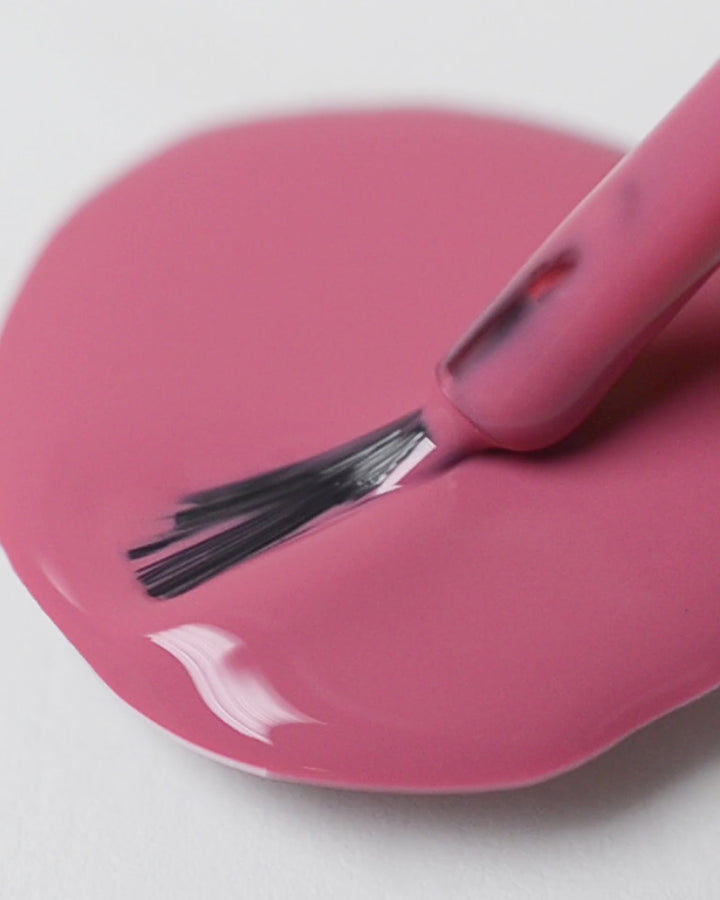 midtone pink nail polish drop by sienna